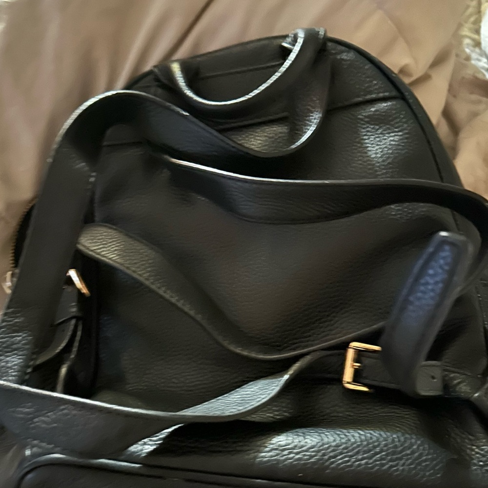 Michael Kors Black Backpack with Gold Accents
Lightly used but in good condition - Picture 2 of 2